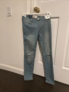 abercrombie kids faded blue skinny jeans with knee tears
